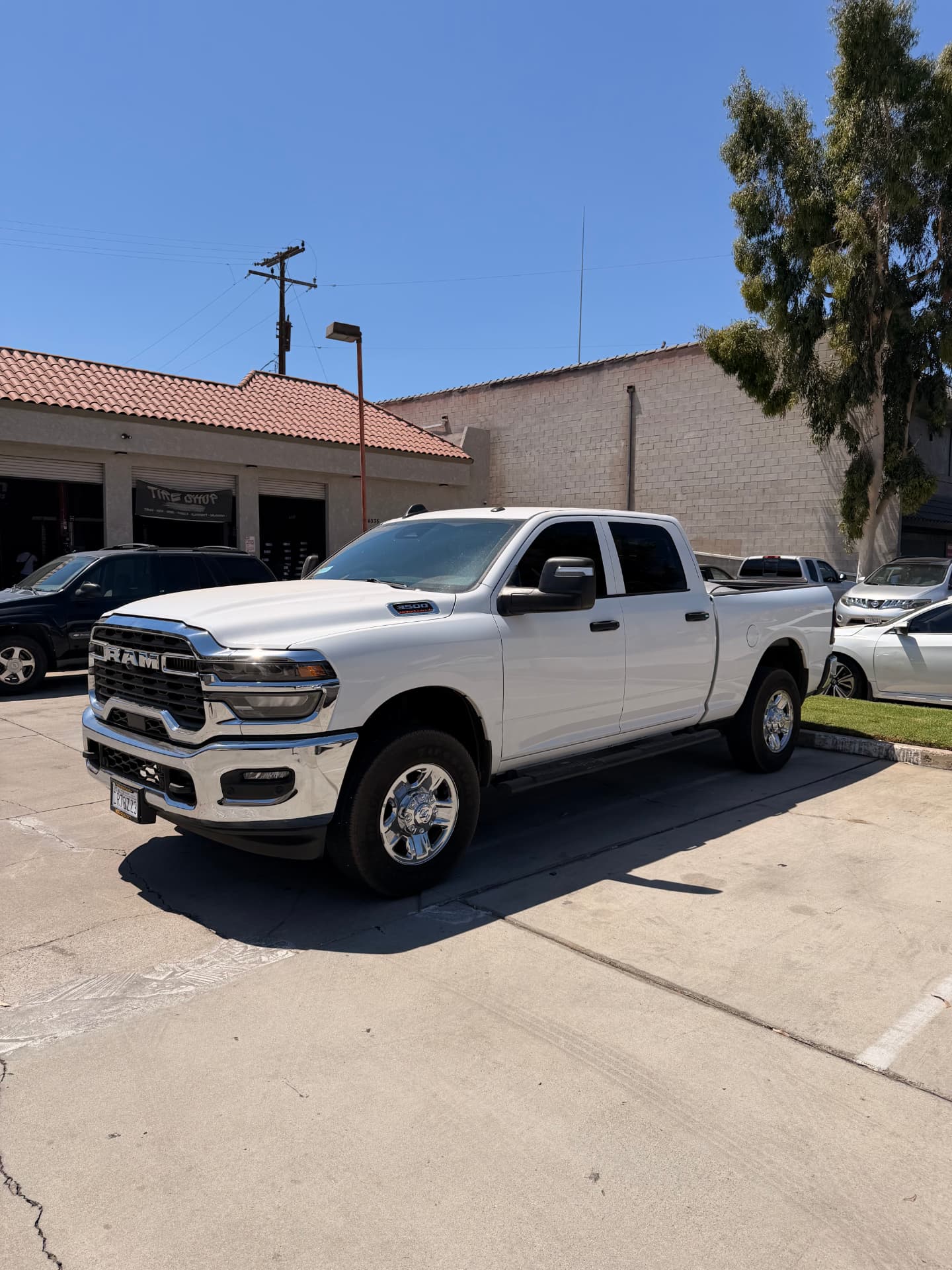 White RAM 3500 truck with freshly tinted windows